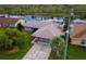 House on a canal with a large yard and driveway at 13340 Country Club Dr, Tavares, FL 32778