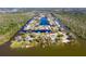 Aerial view of Lake Harris Shores community, showcasing waterfront homes and lush landscape at 13340 Country Club Dr, Tavares, FL 32778