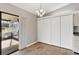 Kitchen dining area with built-in shelving and sliding glass doors at 13340 Country Club Dr, Tavares, FL 32778