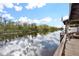Private dock with boat shelter offering waterfront access at 13340 Country Club Dr, Tavares, FL 32778