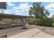Wooden deck and dock with covered boat storage and canal access at 13340 Country Club Dr, Tavares, FL 32778