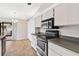 Kitchen with stainless steel appliances and ample counter space at 13340 Country Club Dr, Tavares, FL 32778