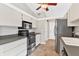 Modern kitchen featuring stainless steel appliances and ample cabinetry at 13340 Country Club Dr, Tavares, FL 32778