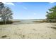 Sandy lakeshore with clear water views at 13340 Country Club Dr, Tavares, FL 32778