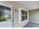 White front door with glass panels and sidelights at 17848 Se 87Th Bourne Ave, The Villages, FL 32162