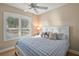 Bedroom with queen-size bed and window at 1805 Feliciana Ter, The Villages, FL 32162