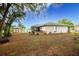 Large backyard with shed and screened patio at 202 Forest Park Ln, Lady Lake, FL 32159