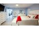 Main bedroom with ensuite access and white furniture at 202 Forest Park Ln, Lady Lake, FL 32159