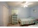 Guest bedroom with twin beds and light blue color scheme at 202 Forest Park Ln, Lady Lake, FL 32159