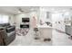 Modern white kitchen with stainless steel appliances and quartz countertops at 202 Forest Park Ln, Lady Lake, FL 32159