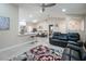 Open living room features a spacious layout, kitchen with island, and seating area at 202 Forest Park Ln, Lady Lake, FL 32159