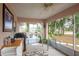 Relaxing screened porch with outdoor furniture and backyard view at 202 Forest Park Ln, Lady Lake, FL 32159