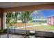 Screened porch with view of backyard and neighboring homes at 202 Forest Park Ln, Lady Lake, FL 32159