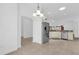 Bright dining room with wood floors and kitchen views at 2176 Blackville Dr, The Villages, FL 32162