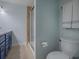 Bathroom with blue vanity, shower, and toilet at 2247 Cypress Cove Dr # E2, Tavares, FL 32778