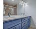 Double vanity bathroom with blue cabinets and white countertop at 2247 Cypress Cove Dr # E2, Tavares, FL 32778
