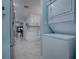 Functional laundry room with washer, dryer and access to kitchen at 2247 Cypress Cove Dr # E2, Tavares, FL 32778
