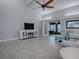 Living room features a fireplace and access to a screened porch at 2247 Cypress Cove Dr # E2, Tavares, FL 32778