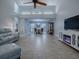 Open concept living room with high ceilings and dining area view at 2247 Cypress Cove Dr # E2, Tavares, FL 32778