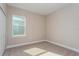 Charming bedroom with a window and neutral wall tones at 2878 Supermarine Rd, Tavares, FL 32778