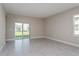 Bright dining area with sliding glass doors leading to the backyard at 2878 Supermarine Rd, Tavares, FL 32778