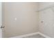 Bright laundry room with wire shelving and hookups at 2878 Supermarine Rd, Tavares, FL 32778