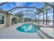 Stunning screened pool and patio area with lake view at 2994 Luraville Rd, The Villages, FL 32163