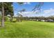 Green backyard featuring a scenic golf course view at 3614 Kingswood Ct, Clermont, FL 34711