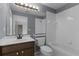 Clean bathroom with single vanity, tub, and shower at 3614 Kingswood Ct, Clermont, FL 34711