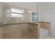Bathroom with shower, built-in seat and soaking tub at 3614 Kingswood Ct, Clermont, FL 34711
