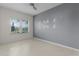 Bedroom with large window and tiled floors at 3614 Kingswood Ct, Clermont, FL 34711