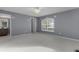 Bright bedroom with ceiling fan and neutral carpeting at 3614 Kingswood Ct, Clermont, FL 34711