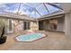 Private courtyard with a spa and covered patio at 3614 Kingswood Ct, Clermont, FL 34711