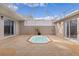 Courtyard oasis with a refreshing spa and covered patio at 3614 Kingswood Ct, Clermont, FL 34711