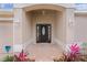 Inviting front entrance with a dark-stained door and brick walkway at 3614 Kingswood Ct, Clermont, FL 34711