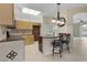 Kitchen with granite countertops, light wood cabinets, and stainless steel appliances at 3614 Kingswood Ct, Clermont, FL 34711