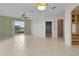 Spacious living room with tile floors and access to backyard at 3614 Kingswood Ct, Clermont, FL 34711