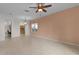 Spacious living room with tile floors and neutral color palette at 3614 Kingswood Ct, Clermont, FL 34711