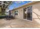 Screened patio with seating area and sliding glass door access at 3614 Kingswood Ct, Clermont, FL 34711