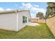 Private backyard with grassy area and patio at 4056 Venetian Ln, The Villages, FL 32163