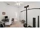 Home gym with weight equipment and desk at 4056 Venetian Ln, The Villages, FL 32163