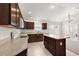 Open concept kitchen with island and stainless steel appliances at 4056 Venetian Ln, The Villages, FL 32163
