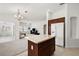 Kitchen features an island that overlooks the living room at 4056 Venetian Ln, The Villages, FL 32163