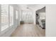 Bright sunroom with light flooring and white plantation shutters at 4056 Venetian Ln, The Villages, FL 32163