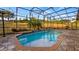 Relaxing screened-in pool and patio area, perfect for outdoor entertaining at 4080 Longbow Dr, Clermont, FL 34711