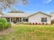 House exterior showcasing a large backyard and screened patio at 4817 Summerbridge Cir, Leesburg, FL 34748