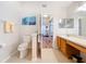 Main bathroom features double sinks and a toilet at 4817 Summerbridge Cir, Leesburg, FL 34748