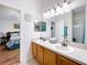Bathroom with double sinks and access to bedroom at 4817 Summerbridge Cir, Leesburg, FL 34748