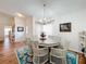 Bright dining room with a round table and chairs near the kitchen at 4817 Summerbridge Cir, Leesburg, FL 34748