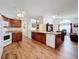 Spacious kitchen with island, wood cabinets, and stainless steel appliances at 4817 Summerbridge Cir, Leesburg, FL 34748